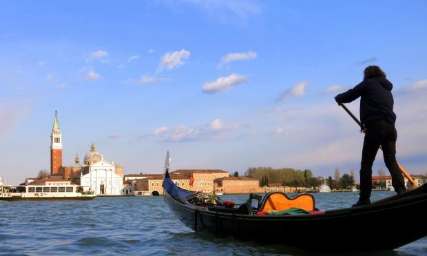 Gondolier with the wind: Venice, Italy