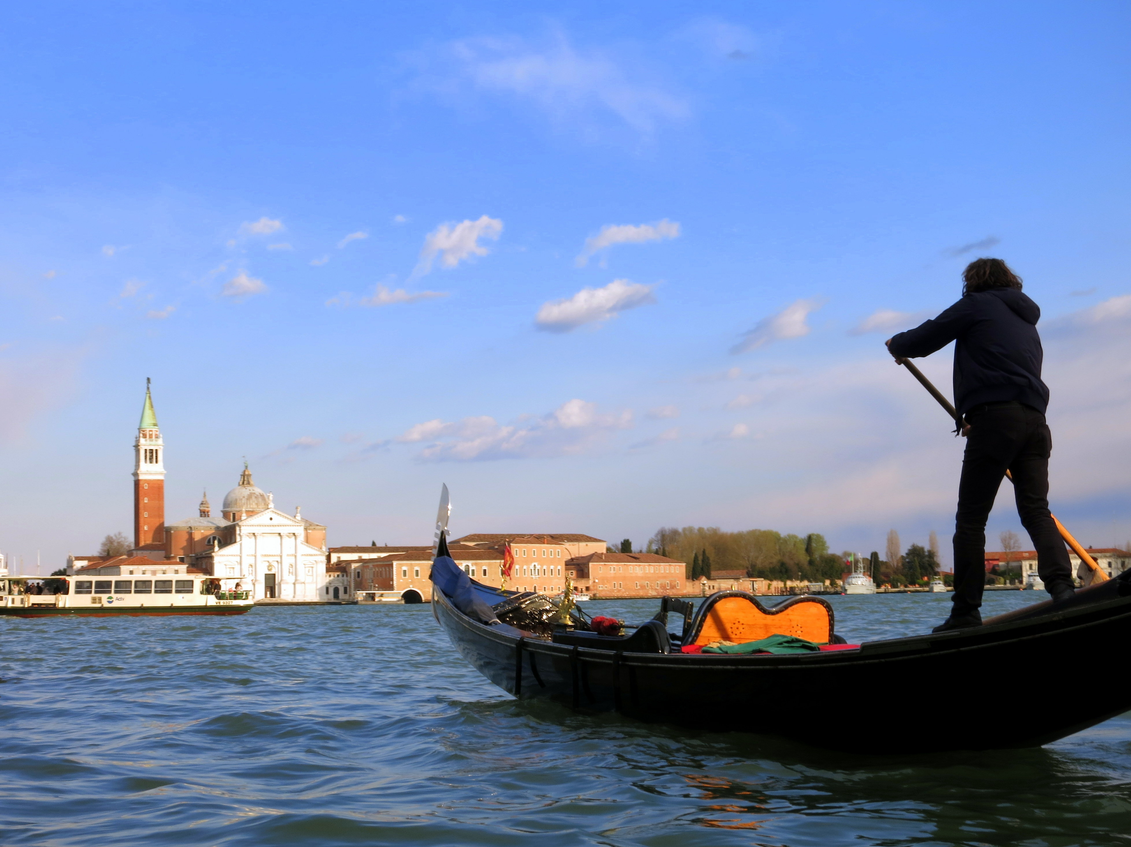 Gondolier with the wind: Venice, Italy